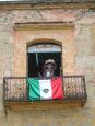 A figure from a Deigo Rivera mural adorns a window