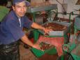 Vendor grinds up a blend of chocolate, cinnamon and almonds