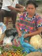 The multicoloured attire of the market vendors