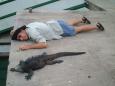 Nico and marine iguana, Charles Darwin Research Station