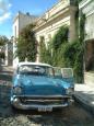 A vintage car in a rustic town