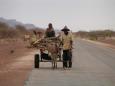 Travelers on the desert road