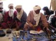 The merchants prepare their wares in traditional style