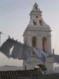 Washing fluttering in the wind at the church in Hora