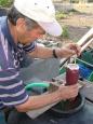 John reads the specific gravity of the grape juice to determine its sweetness