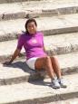 Keiko reclines on thousand-year-old steps at Phaestos