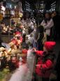 Child mesmerized by animated Christmas window display