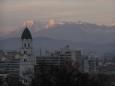 Ljubljana urban scene with Julian Alps catching the day's final rays