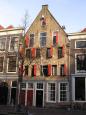 Red shutters adorn a Dutch-style apartment home