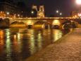 The River Seine, Pont Louis-Philippe and Notre-Dame sparkle by night