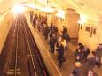 A train rockets into the Park Kultury Metro station