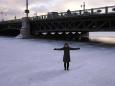 Keiko stands on the frozen Neva River at the Dvortsovy Bridge